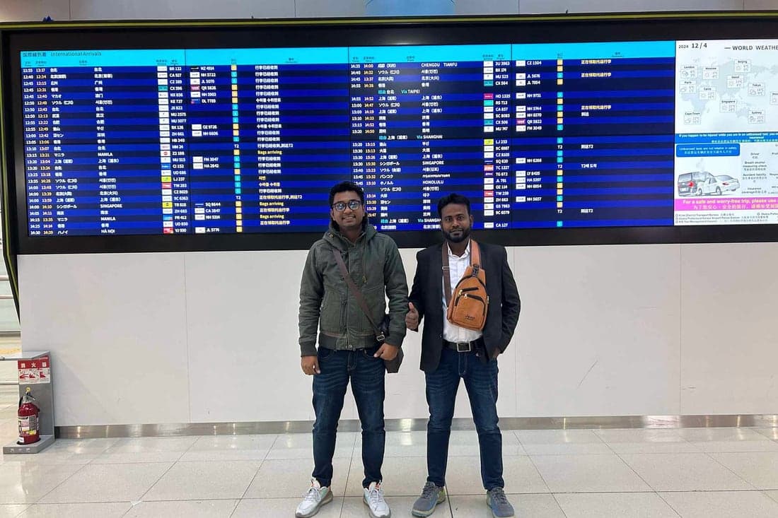 Two Discovery candidates in the international arrivals hall of a Japanese airport